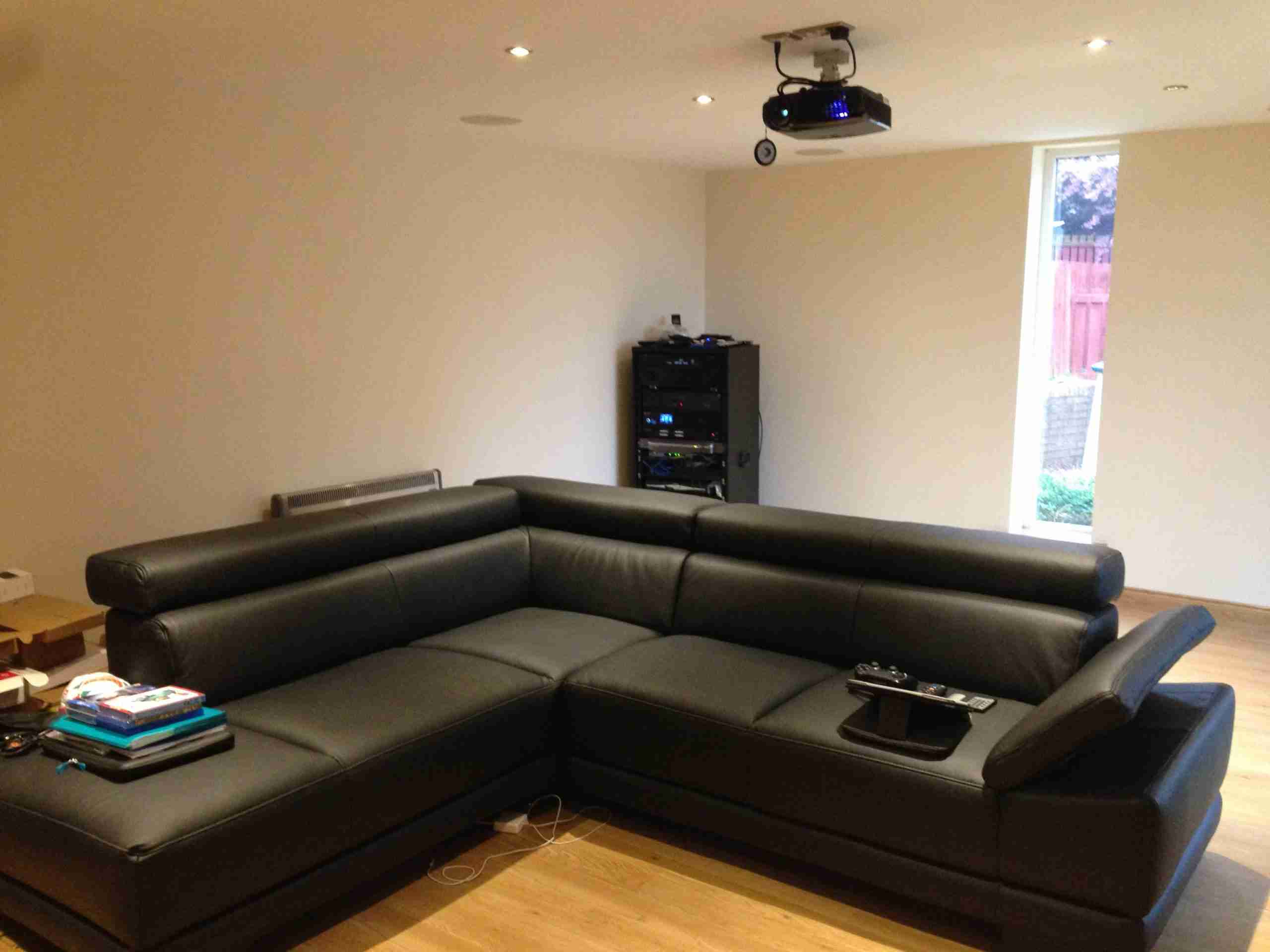 Sofa, projector and speakers in the garden cabin cinema Sofa, projector and speakers in the garden cabin cinema