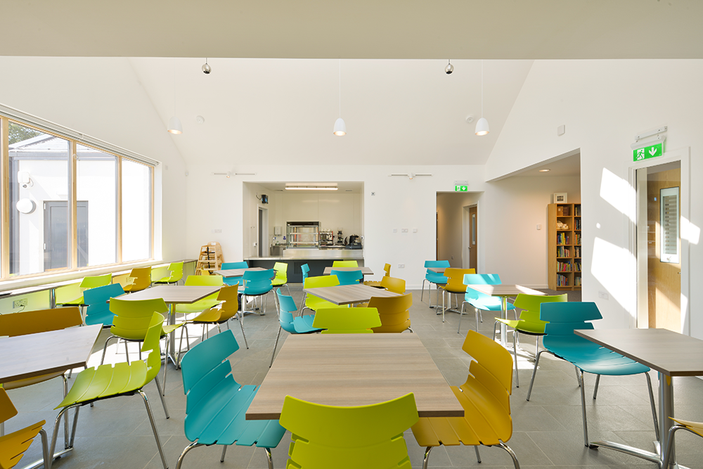 The café at Ochiltree Community Hub, East Ayrshire, with pendant speakers in the vaulted ceiling The café at Ochiltree Community Hub, East Ayrshire, with pendant speakers in the vaulted ceiling
