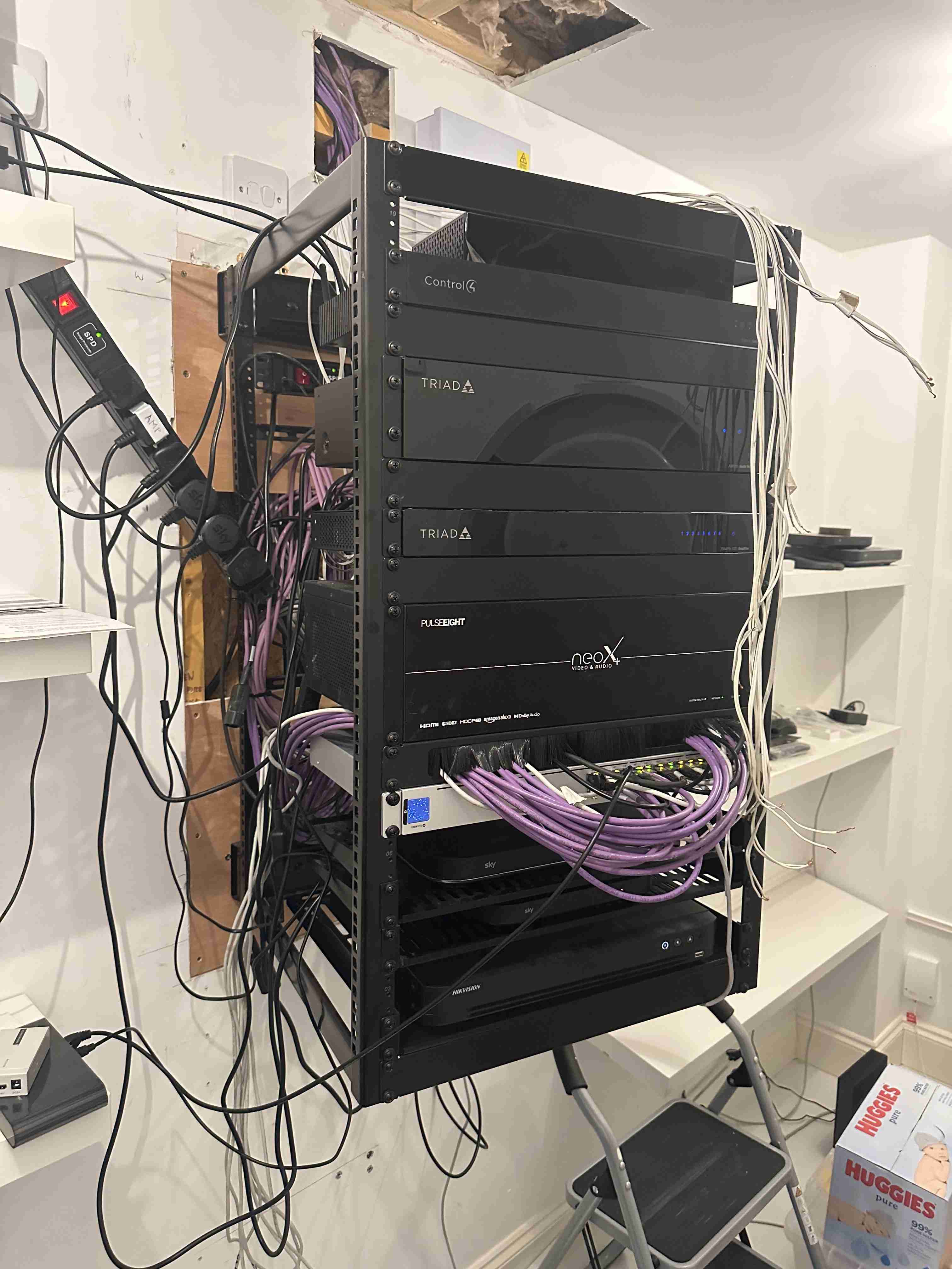 A previous installation found on site, with unmanaged cabling and no containment